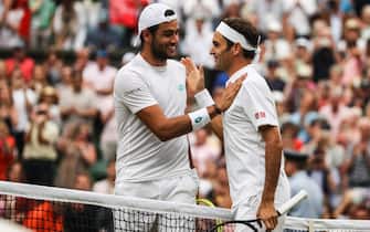 LONDON, ENGLAND - JULY 08: Roger Federer (R) of Switzerland greets Matteo Berrettini of Italy after their Men's Singles fourth round match against during Day Seven of The Championships - Wimbledon 2019 at All England Lawn Tennis and Croquet Club on July 08, 2019 in London, England. (Photo by Shi Tang/Getty Images)