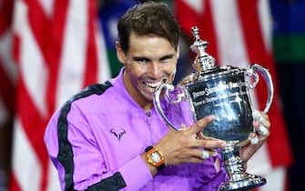 NEW YORK, NEW YORK - SEPTEMBER 08: Rafael Nadal of Spain celebrates with the championship trophy during the trophy presentation ceremony after winning his Men's Singles final match against Daniil Medvedev of Russia on day fourteen of the 2019 US Open at the USTA Billie Jean King National Tennis Center on September 08, 2019 in the Queens borough of New York City.   (Photo by Clive Brunskill/Getty Images)
