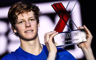 Italy's Jannik Sinner poses with the winner's trophy after defeating Australia's Alex De Minaur during the final of the Next Generation ATP Finals at the Allianz Cloud Court on November 9, 2019 in Milan. (Photo by Marco Bertorello / AFP) (Photo by MARCO BERTORELLO/AFP via Getty Images)