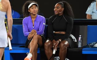 Naomi Osaka of Japan (L) and Serena Williams of the US (R) share a lighter moment as they and other top players play in the Rally for Relief charity tennis match in support of the victims of the Australian bushfires, in Melbourne of January 15, 2020, ahead of the Australian Open tennis tournament. (Photo by WILLIAM WEST / AFP) / -- IMAGE RESTRICTED TO EDITORIAL USE - STRICTLY NO COMMERCIAL USE -- (Photo by WILLIAM WEST/AFP via Getty Images)