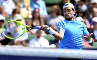 1193940042 Matteo Berrettini of Italy hits a return during his men's singles match against Stefanos Tsitsipas of Greece at the Kooyong Classic tennis tournament in Melbourne on January 16, 2020. (Photo by William WEST / AFP) / IMAGE RESTRICTED TO EDITORIAL USE - STRICTLY NO COMMERCIAL USE (Photo by WILLIAM WEST/AFP via Getty Images)