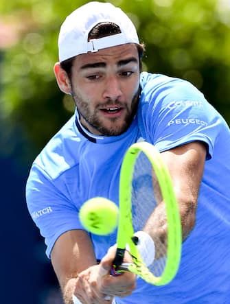1193940069 Matteo Berrettini of Italy hits a return during his men's singles match against Stefanos Tsitsipas of Greece at the Kooyong Classic tennis tournament in Melbourne on January 16, 2020. (Photo by William WEST / AFP) / IMAGE RESTRICTED TO EDITORIAL USE - STRICTLY NO COMMERCIAL USE (Photo by WILLIAM WEST/AFP via Getty Images)