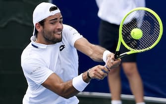 1193817459 Matteo Berrettini of Italy hits a return in his match against Marc Polmans of Australia at the Kooyong Classic tennis tournament in Melbourne on January 15, 2020. (Photo by William WEST / AFP) / --IMAGE RESTRICTED TO EDITORIAL USE - NO COMMERCIAL USE-- (Photo by WILLIAM WEST/AFP via Getty Images)