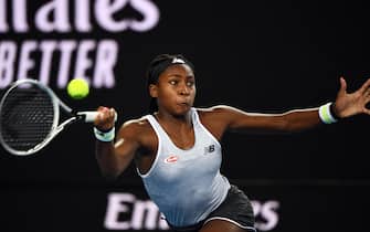 Coco Gauff of the US hits a return against Venus Williams of the US during their women's singles match on day one of the Australian Open tennis tournament in Melbourne on January 20, 2020. (Photo by Manan VATSYAYANA / AFP) / IMAGE RESTRICTED TO EDITORIAL USE - STRICTLY NO COMMERCIAL USE (Photo by MANAN VATSYAYANA/AFP via Getty Images)