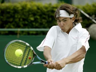 LONDON - JUNE 25:  Rafael Nadal of Spain in action on his way to winning his match against Lee Childs during day three of the Wimbledon Tennis Championships at the All England Lawn Tennis Club June 25, 2003 in London, England.  (Photo by Alex Livesey/Getty Images)