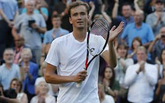 Russia's Daniil Medvedev appluads the crowd after winning against Switzerland's Stan Wawrinka during their men's singles first round match on the first day of the 2017 Wimbledon Championships at The All England Lawn Tennis Club in Wimbledon, southwest London, on July 3, 2017.
Medvedev won 6-4, 3-6, 6-4, 6-1. / AFP PHOTO / Adrian DENNIS / RESTRICTED TO EDITORIAL USE        (Photo credit should read ADRIAN DENNIS/AFP via Getty Images)