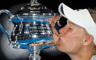 MELBOURNE, AUSTRALIA - JANUARY 27:  Caroline Wozniacki of Denmark kisses the Daphne Akhurst Memorial Cup after winning the women's singles final against Simona Halep of Romania on day 13 of the 2018 Australian Open at Melbourne Park on January 27, 2018 in Melbourne, Australia.  (Photo by Scott Barbour/Getty Images)