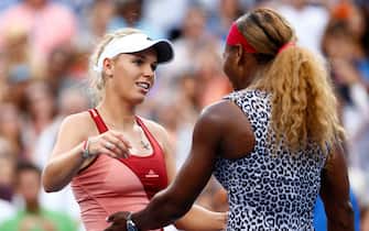 NEW YORK, NY - SEPTEMBER 07:  Serena Williams of the United States hugs Caroline Wozniacki of Denmark after their women's singles final match on Day fourteen of the 2014 US Open at the USTA Billie Jean King National Tennis Center on September 7, 2014 in the Flushing neighborhood of the Queens borough of New York City. Williams defeated Wozniacki in two sets by a score of 6-3, 6-3.  (Photo by Julian Finney/Getty Images)