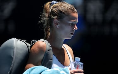 against Italy's Camila Giorgi walks off the court after losing to Germany's Angelique in women's singles match on day six of the Australian Open tennis tournament in Melbourne on January 25, 2020. (Photo by DAVID GRAY / AFP) / IMAGE RESTRICTED TO EDITORIAL USE - STRICTLY NO COMMERCIAL USE (Photo by DAVID GRAY/AFP via Getty Images)