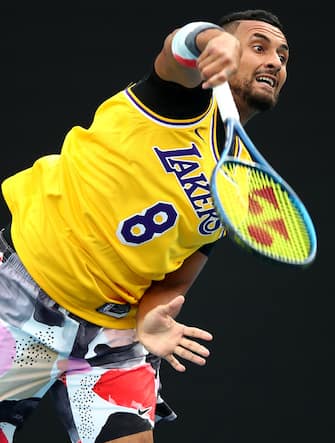 MELBOURNE, AUSTRALIA - JANUARY 27: Nick Kyrgios of Australia serves as he warms up wearing a number 8 Kobe Bryant Jersey ahead of his Men's Singles fourth round match against Rafael Nadal of Spain on day eight of the 2020 Australian Open at Melbourne Park on January 27, 2020 in Melbourne, Australia. (Photo by Clive Brunskill/Getty Images)