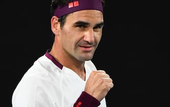 TOPSHOT - Switzerland's Roger Federer celebrates after victory against Hungary's Marton Fucsovics during their men's singles match on day seven of the Australian Open tennis tournament in Melbourne on January 26, 2020. (Photo by William WEST / AFP) / IMAGE RESTRICTED TO EDITORIAL USE - STRICTLY NO COMMERCIAL USE (Photo by WILLIAM WEST/AFP via Getty Images)