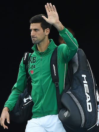 MELBOURNE, AUSTRALIA - JANUARY 28: Novak Djokovic of Serbia waves to the crowd before his Men s Singles Quarterfinal match against Milos Raonic of Canada on day nine of the 2020 Australian Open at Melbourne Park on January 28, 2020 in Melbourne, Australia. (Photo by Morgan Hancock/Getty Images)