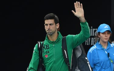 MELBOURNE, AUSTRALIA - JANUARY 28: Novak Djokovic of Serbia waves to the crowd before his Men s Singles Quarterfinal match against Milos Raonic of Canada on day nine of the 2020 Australian Open at Melbourne Park on January 28, 2020 in Melbourne, Australia. (Photo by Morgan Hancock/Getty Images)