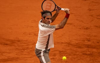 PARIS, FRANCE - JUNE 07: Roger Federer of Switzerland hits a backhand against Rafael Nadal of Spain in the semi finals of the men's singles during Day 13 of the 2019 French Open at Roland Garros on June 07, 2019 in Paris, France. (Photo by TPN/Getty Images)