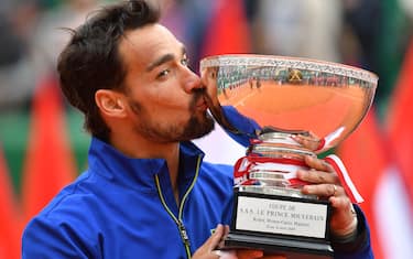 TOPSHOT - Winner Italy's Fabio Fognini kisses the trophy after winning the final tennis match against Serbia's Dusan Lajovic at the Monte-Carlo ATP Masters Series tournament in Monaco on April 21, 2019. (Photo by YANN COATSALIOU / AFP)        (Photo credit should read YANN COATSALIOU/AFP via Getty Images)