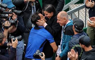 1138511301 Italy's Fabio Fognini (L) kisses his wife Flavia Pennetta as he celebrates his victory over Serbia's Dusan Lajovic at the end of the final tennis match of the Monte-Carlo ATP Masters Series tournament in Monaco on April 21, 2019. (Photo by VALERY HACHE / AFP) (Photo credit should read VALERY HACHE/AFP via Getty Images)
