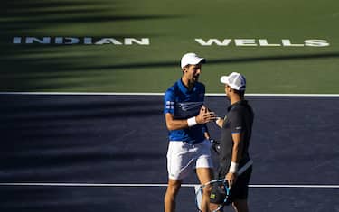 INDIAN WELLS, CALIFORNIA - MARCH 08: Novak Djokovic of Serbia and Fabio Fognini of Italy in action in the first round of the 
men's doubles against Milos Raonic of Canada and Jeremy Chardy of France on March 08, 2019 at the Indian Wells Tennis Garden in Indian Wells, California. (Photo by TPN/Getty Images)