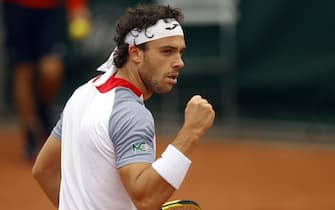 epa08701059 Marco Cecchinato of Italy reacts as he plays Alex de Minaur of Australia during their menâ  s first round match during the French Open tennis tournament at Roland Garros in Paris, France, 27 September 2020.  EPA/IAN LANGSDON