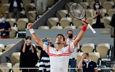 Serbia's Novak Djokovic celebrates after winning against Spain's Rafael Nadal at the end of their men's singles semi-final tennis match on Day 13 of The Roland Garros 2021 French Open tennis tournament in Paris on June 11, 2021. (Photo by MARTIN BUREAU / AFP) (Photo by MARTIN BUREAU/AFP via Getty Images)