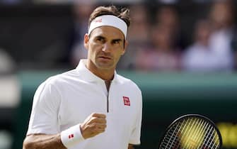 epa07716782 Roger Federer of Switzerland scores against Novak Djokovic of Serbia in the men's final of the Wimbledon Championships at the All England Lawn Tennis Club, in London, Britain, 14 July 2019. EPA/NIC BOTHMA EDITORIAL USE ONLY/NO COMMERCIAL SALES