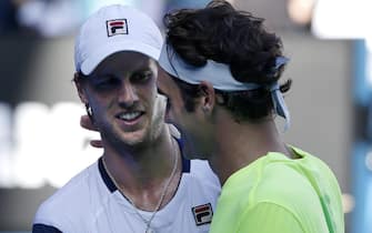 epa04577761 Andreas Seppi (L) of Italy is congratulated by Roger Federer (R) of Switzerland after Seppi won their third round match at the Australian Open Grand Slam tennis tournament in Melbourne, Australia, 23 January 2015. The Australian Open tennis tournament runs from 19 January until 01 February 2015.  EPA/Barbara Walton