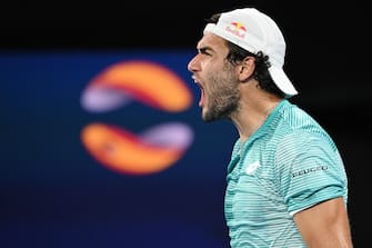 epa08990535 Matteo Berrettini of Italy celebrates his win over Roberto Bautista Agut of Spain during their semi-finals match at the ATP Cup tennis tournament at Melbourne Park in Melbourne, Australia, 06 February 2021.  EPA/DEAN LEWINS  AUSTRALIA AND NEW ZEALAND OUT