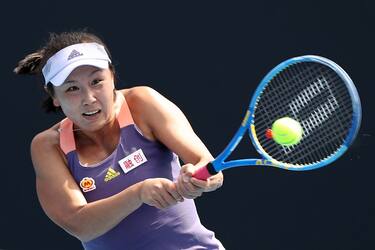 MELBOURNE, AUSTRALIA - JANUARY 21:  Shuai Peng of China plays a backhand during her Women's Singles first round match against Nao Hibino of Japan on day two of the 2020 Australian Open at Melbourne Park on January 21, 2020 in Melbourne, Australia. (Photo by Mark Kolbe/Getty Images)