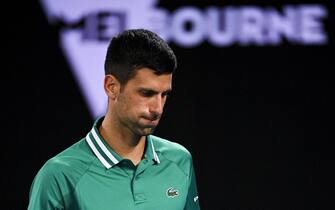 epa09006703 Novak Djokovic of Serbia reacts during his third Round Men's singles match against Taylor Fritz of the United States of America on Day 5 of the Australian Open at Melbourne Park in Melbourne, Victoria, Australia, 12 February 2021.  EPA/DEAN LEWINS