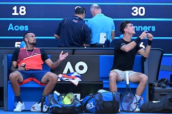 epa09707457 Nick Kyrgios (L) and Thanasi Kokkinakis (R) of Australia remonstrate with the chair umpire during their doubles quarter final match against Tim Puetz of Germany and Michael Venus of New Zealand at the Australian Open Grand Slam tennis tournament at Melbourne Park, in Melbourne, Australia, 25 January 2022.  EPA/DAVE HUNT AUSTRALIA AND NEW ZEALAND OUT