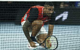 MELBOURNE, AUSTRALIA - JANUARY 29: Nick Kyrgios of Australia in action in his Men's Doubles Final match with Thanasi Kokkinakis of Australia against Matthew Ebden of Australia and Max Purcell of Australia during day 13 of the 2022 Australian Open at Melbourne Park on January 29, 2022 in Melbourne, Australia. (Photo by Darrian Traynor/Getty Images)