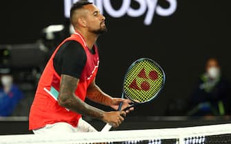 Australia's Nick Kyrgios looks on as he plays with Australia's Thanasi Kokkinakis against Australia's Matthew Ebden and Australia's Max Purcell during their men's doubles final match on day thirteen of the Australian Open tennis tournament in Melbourne on January 29, 2022. - -- IMAGE RESTRICTED TO EDITORIAL USE - STRICTLY NO COMMERCIAL USE -- (Photo by Aaron FRANCIS / AFP) / -- IMAGE RESTRICTED TO EDITORIAL USE - STRICTLY NO COMMERCIAL USE -- (Photo by AARON FRANCIS/AFP via Getty Images)