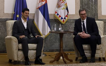 Serbian tennis player Novak Djokovic (L) and Serbian President Aleksandar Vucic pose for a photograph durig their meeting in Belgrade on February 3, 2022.
