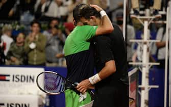 Argentine tennis player Juan Martin Del Potro is greeted by Argentine Federico Delbonis at the end of their ATP 250 Argentina Open tennis tournament match in Buenos Aires, on February 8, 2022. - Federico del Bonis won 6-1 and 6-3. (Photo by Juan Mabromata / AFP) (Photo by JUAN MABROMATA/AFP via Getty Images)