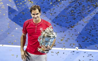 epa07954039 Roger Federer of Switzerland  poses with his trophy after defeating Alex De Minaur of Australia after the final match at the Swiss Indoors tennis tournament at the St. Jakobshalle in Basel, Switzerland, on Sunday, October 27, 2019.  EPA/ALEXANDRA WEY