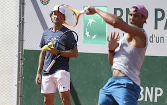 PARIS, FRANCE - MAY 29: Rafael Nadal of Spain and his coach Carlos Moya during practice ahead of the French Open 2021, Grand Slam tennis tournament at Roland-Garros stadium on May 29, 2021 in Paris, France. (Photo by John Berry/Getty Images)
