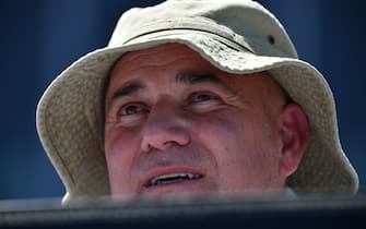 Andre Agassi, coach of Bulgaria's Grigor Dimitrov, watches him play Serbia's Janko Tipsarevic during their men's singles match on day one of the Australian Open tennis tournament in Melbourne on January 14, 2019. (Photo by SAEED KHAN / AFP) / -- IMAGE RESTRICTED TO EDITORIAL USE - STRICTLY NO COMMERCIAL USE --        (Photo credit should read SAEED KHAN/AFP via Getty Images)