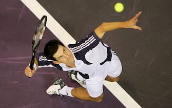 MADRID, SPAIN - OCTOBER 17: Tim Henman of Great Britain in action against Taylor Dent of USA in the first round of the ATP Madrid Masters at the Nuevo Rockodromo on October 17, 2005 in Madrid, Spain.  (Photo by Julian Finney/Getty Images)