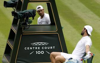 67557016 Rafael Nadal (top) and Matteo Berrettini have a discussion as they practice on centre court ahead of the 2022 Wimbledon Championship at the All England Lawn Tennis and Croquet Club, Wimbledon. Picture date: Thursday June 23, 2022.