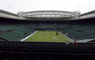 Rafael Nadal (top of court) and Matteo Berrettini practice on centre court ahead ahead of the 2022 Wimbledon Championship at the All England Lawn Tennis and Croquet Club, Wimbledon. Picture date: Thursday June 23, 2022. (Photo by Steven Paston/PA Images via Getty Images)
