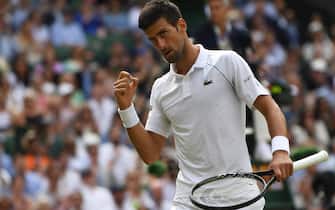 epa09337573 Novak Djokovic of Serbia reacts during the men's final against Matteo Berrettini of Italy at the Wimbledon Championships, Wimbledon, Britain 11 July 2021.  EPA/NEIL HALL   EDITORIAL USE ONLY