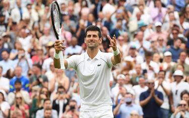 epa10036916 Novak Djokovic of Serbia celebrates after winning the men's first round match against Kwon Soon-woo of South Korea at the Wimbledon Championships, in Wimbledon, Britain, 27 June 2022. Djokovic won in four sets.  EPA/ANDY RAIN   EDITORIAL USE ONLY
