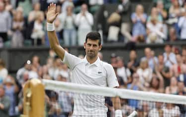 epa10036956 Novak Djokovic of Serbia celebrates after winning his men's first round match against Kwon Soon-woo of South Korea at the Wimbledon Championships in Wimbledon, Britain, 27 June 2022.  EPA/PETER KLAUNZER   EDITORIAL USE ONLY