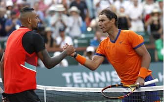 epa09832729 Rafael Nadal of Spain (R) shakes hands with Nick Kyrgios of Australia at the net after their match at the BNP Paribas Open tennis tournament at the Indian Wells Tennis Garden in Indian Wells, California, USA, 17 March 2022. Nadal defeated Kyrgios in two tie-break sets, 7-6 (0), 6-4.  EPA/JOHN G MABANGLO