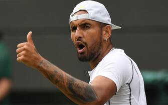 epa10055246 Nick Kyrgios of Australia reacts in the men's quarter final match against Cristian Garin of Chile at the Wimbledon Championships, in Wimbledon, Britain, 06 July 2022.  EPA/NEIL HALL   EDITORIAL USE ONLY
