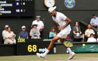LONDON, ENGLAND - JULY 10: Nick Kyrgios of Australia plays a tweener against Novak Djokovic of Serbia during their Men's Singles Final match on day fourteen of The Championships Wimbledon 2022 at All England Lawn Tennis and Croquet Club on July 10, 2022 in London, England. (Photo by Ryan Pierse/Getty Images)