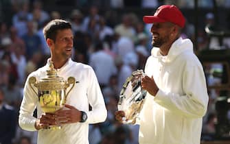 LONDON, ENGLAND - JULY 10: Winner Novak Djokovic of Serbia (L) and runner up Nick Kyrgios of Australia pose for a photo with their trophies following their Men's Singles Final match on day fourteen of The Championships Wimbledon 2022 at All England Lawn Tennis and Croquet Club on July 10, 2022 in London, England. (Photo by Julian Finney/Getty Images)