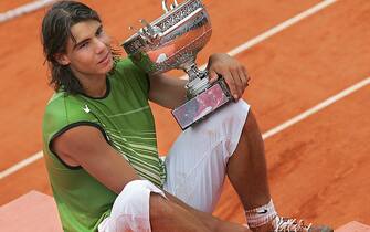 PARIS, France:  Spanish Rafael Nadal holds his trophy after his men's final match of the tennis French Open at Roland Garros against Argentinian Mariano Puerta, 05 June 2005 in Paris. Nadal won 6-7(6) 6-3 6-1 7-5.AFP PHOTO / CHRISTOPHE SIMON  (Photo credit should read CHRISTOPHE SIMON/AFP via Getty Images)
