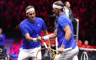 Team Europe's Rafael Nadal (right) and Roger Federer in action against Team World's Frances Tiafoe and Jack Sock on day one of the Laver Cup at the O2 Arena, London. Picture date: Friday September 23, 2022.
