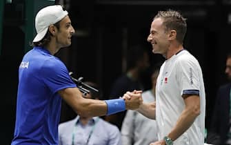 Italian tennis player Lorenzo Musetti jubilates with Filippo Volandri after winning against Croatian player Borna Gojo during the match of Davis Cup by Rakuten Final Group Stage A at Unipol Arena in Casalecchio (Bologna) Italy, 14 September 2022. ANSA /ELISABETTA BARACCHI