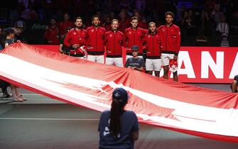 epa10325506 Canada's team listen the national anthem before the Jan-Lennard Struff and Denis Shapovalov match of the Davis Cup finals' quarter-finals between Germany and Canada in Malaga, southern Spain, 24 November 2022.  EPA/JORGE ZAPATA